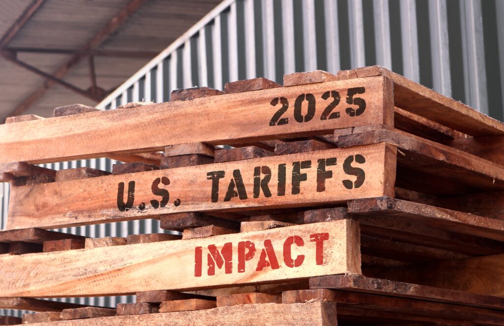 2025UsTariffsImpactTextWrittenOnPiled-upPalletsSupply | TechSplicit Chipmakers May Evade Tariffs but Not the Full Effects